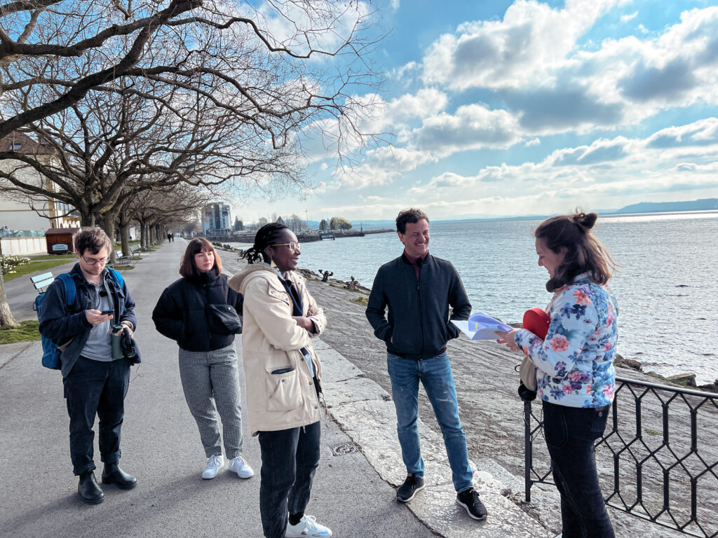 A group of people receiving instructions on how to shoot a scene.